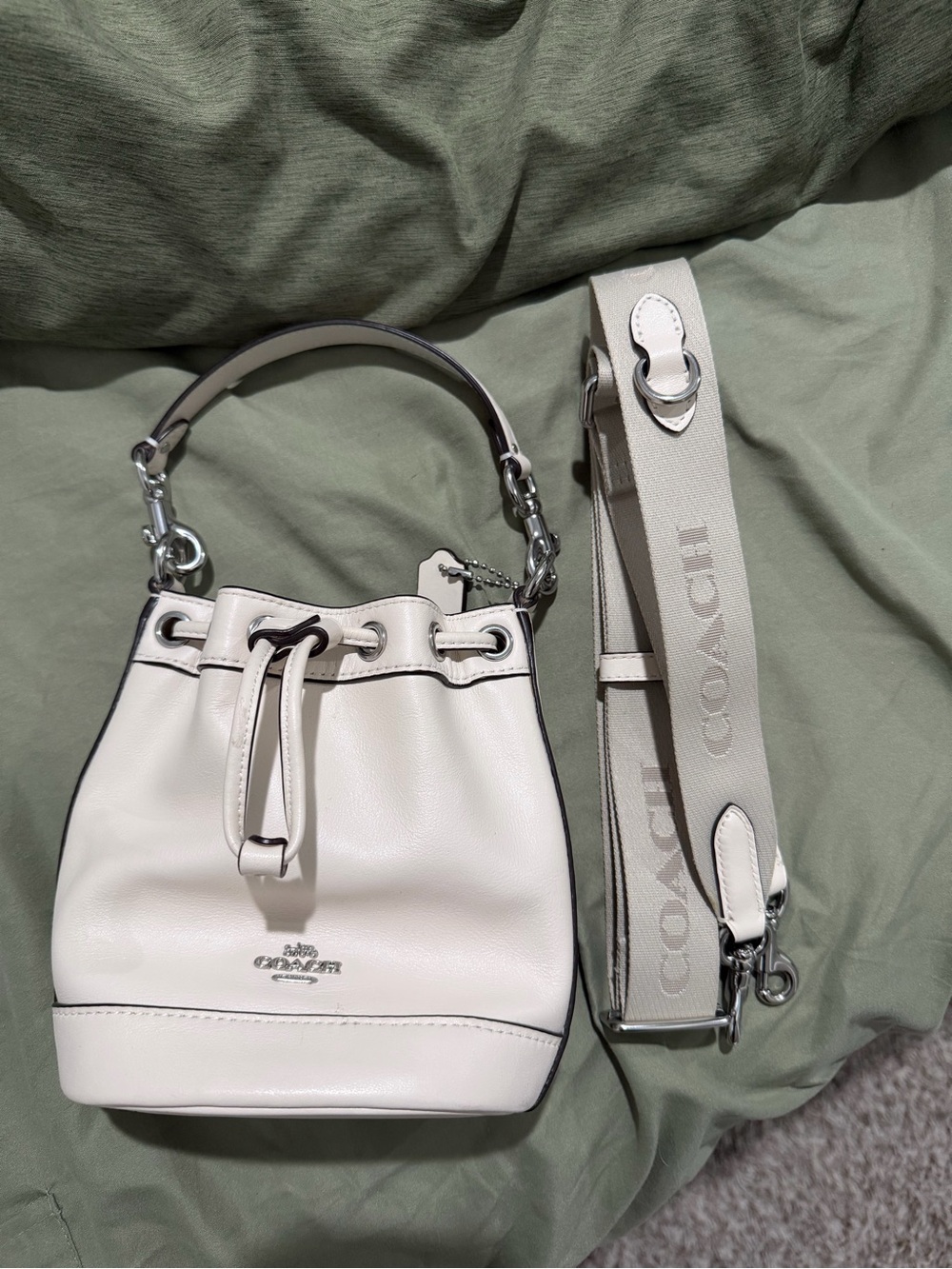 Coach Cream Pebbled Leather Mini Drawstring Bucket Bag with Logo Strap